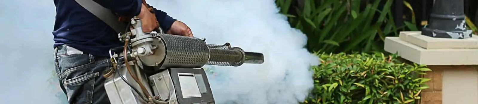 Commercial disinfectant services employee fogging a property to sanitize it.